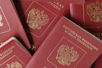 Fototapeta premium Russian Passports. Travel Documents. Foreign Passport. Closeup of National Passport of the Russian Federation. Vacation and tourism concept. High Angle View. Flat Lay.