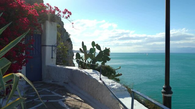 A View of small church perched on the rocks of Arvanitia Promenade in Nafplio