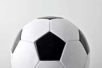 Background with half classic leather stitched soccer ball