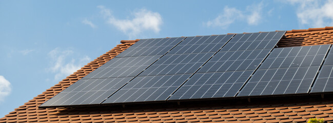 New ecologic house with solar panels Alternative to conventional energy. The battery is charged...