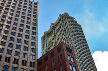 Fototapeta na wymiar Exterior of beautiful buildings against blue sky, low angle view