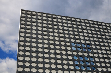 Modern building against blue sky, low angle view