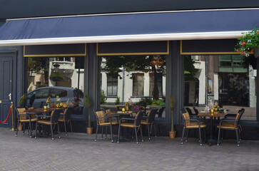 Beautiful view of outdoor cafe with stylish furniture
