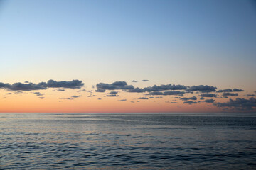 Picturesque view of sea under beautiful sky at sunset