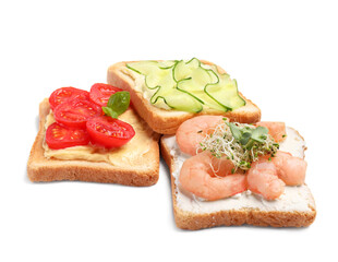 Delicious toasts with different toppings isolated on white