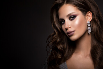 Fototapeta premium Beautiful woman with professional make up and curly hair