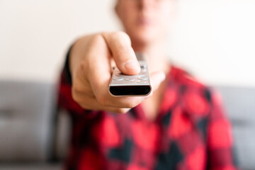 Person turning on tv