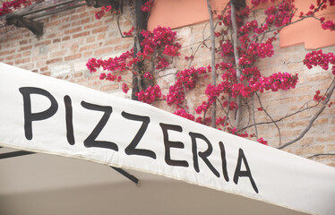 Italian pizzeria restaurant sign with copy space