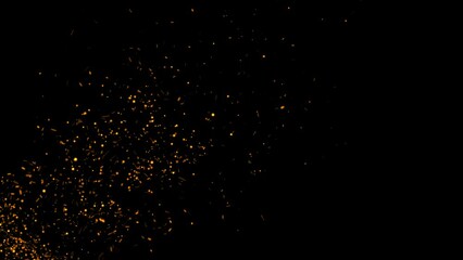Particles of fire sparks rising through the screen on black background. Fire flame particles flying over black screen background
