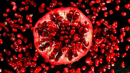 Fresh sliced pomegranate flying, freeze motion