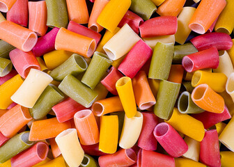 Uncooked colored italian pasta cannelloni, top shot