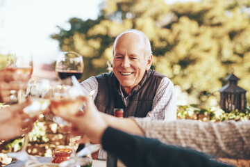 Wine, cheers and grandpa in christmas toast with family for holiday celebration together with food...