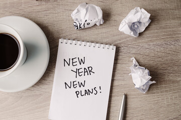 New Year motivational quotes with crumpled paper and coffee