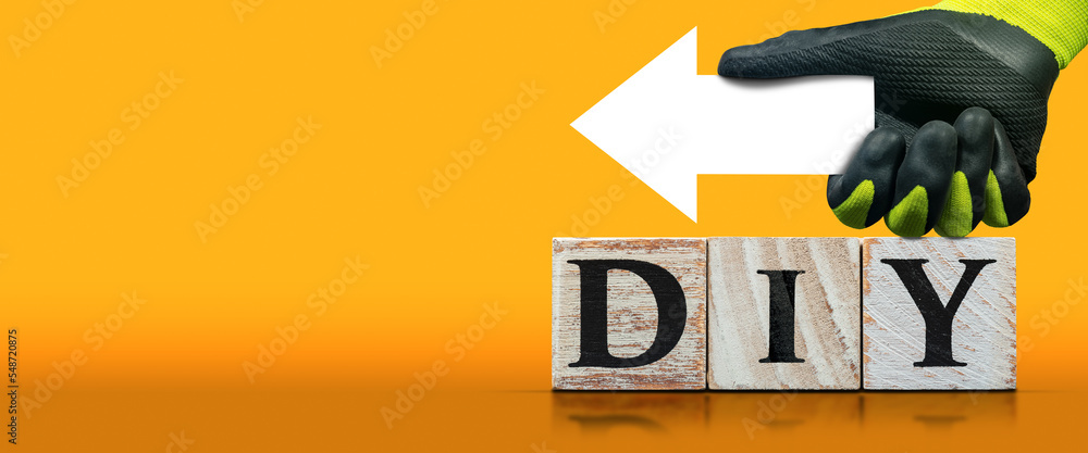 Poster text diy (do it yourself), made of wooden blocks on orange and yellow background with copy space and