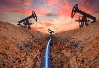 Construction Gas Pipeline Project on sunset background. Natural Gas and Crude oil  Transmission in...