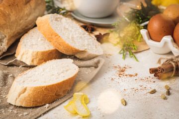 Ingredients for preparing spanish torrijas, french toasts  or traditional Portuguese rabanadas for Christmas. Typical sweet food for Christmas made with slices of bread, eggs, cinnamon, milk and lemon