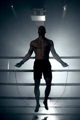 Boxer jumping rope in boxing ring. High quality photo