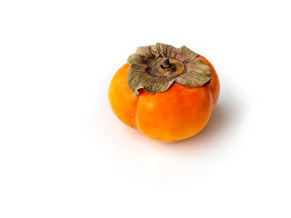 
A persimmon lying on a white background.