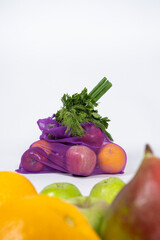 Fabric mesh for fruits and vegetables on a white background. A reusable alternative to plastic bags.