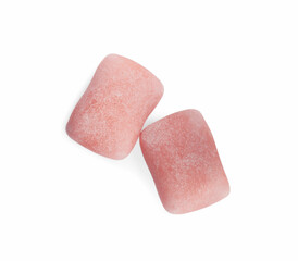 Tasty sweet chewing gums on white background, top view