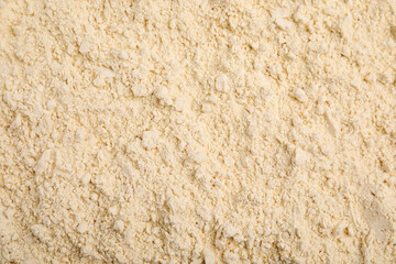 Closeup of chickpea flour as background, top view