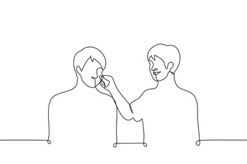 man grabbed his friend by the cheek and smiles - one line drawing vector. concept to be touched by someone, have fun, pinch on the cheek