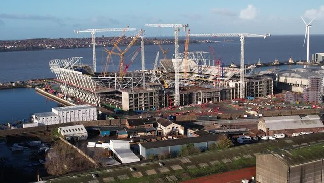 Aerial Drone rising shot of Everton Football Club new Waterfront stadium under construction 