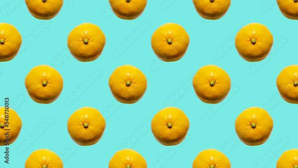Poster orange mandarins in grid in seamless loop pattern on a light blue background. exotic fruits in seaml