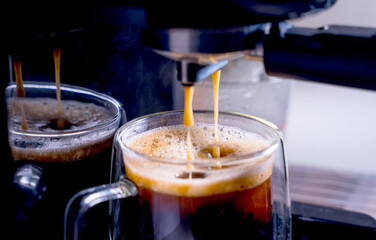close-up of Coffee foam. espresso crema comes out of the fully automatic coffee machine, Making the coffee machine into a cup. 