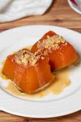 Zucchini dessert with tahini. Traditional Turkish cuisine delicacies. Local name tahinli kabak tatlisi. close up