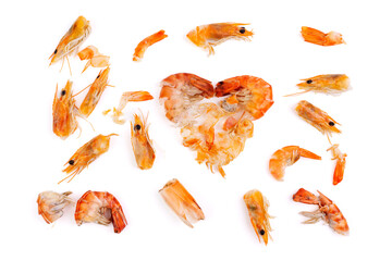 Heart shaped prawn heads and shells, scraps, leftovers, waste. Natural seafood. Lunch. Dinner isolated on white background.