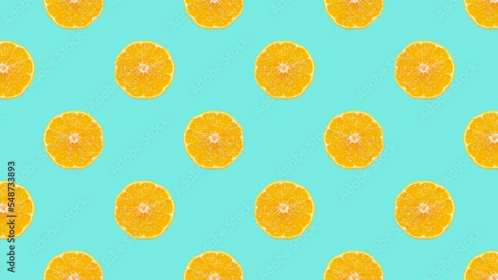 Leinwandbilder mandarin slices in animated grid seamless loop pattern on a pale blue background. abstract backgroun