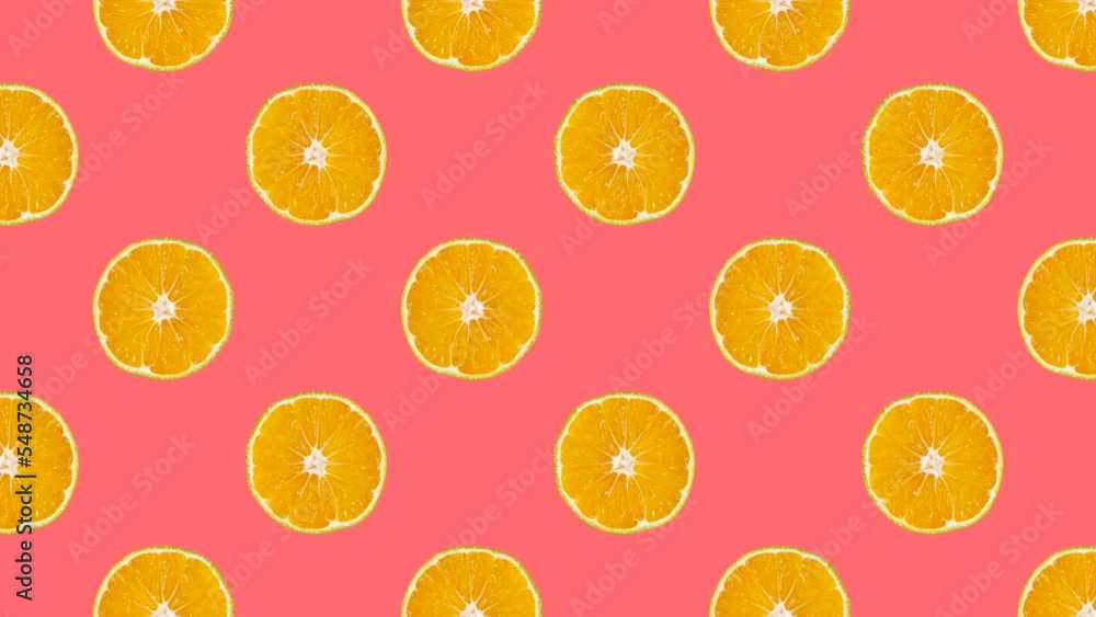 Leinwandbilder mandarin slices in animated grid seamless loop pattern on a coral background. abstract background wi