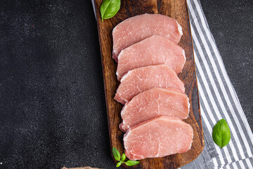 raw pork fresh cuts of meat steak slices fresh delicious snack healthy meal food snack diet on the...