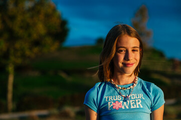 Naklejka premium The little girl very happy relaxed in nature.