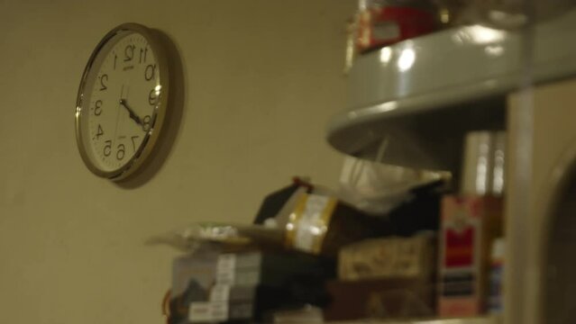 Vintage wall clock, retro items, video clock ticking, Hongkong. reverse clock.