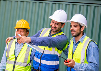 Happy multiethnic professional engineers teamwork smiling and laughing together. Worker team's achievements and happiness at work
