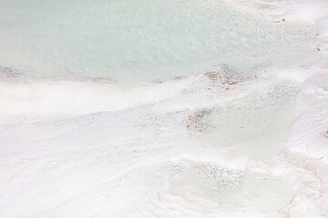 Emerald water in white limestone rock.