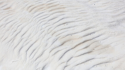 White volcanic limestone rock as background.