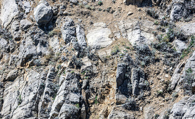 Stone rock in the mountains as an abstract background.