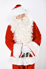 Portrait of father Christmas in studio with white background in a red costume for Christian winter holiday celebration. Marketing, senior or santa claus face with sales offer, promo or discount deals