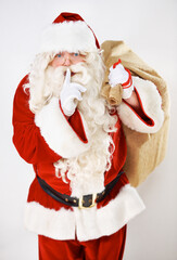 Father christmas, santa and secret whisper of a fat holiday man with present and gift bag. Celebration event of a hush santa claus with glasses smile with celebration magic of gratitude holidays