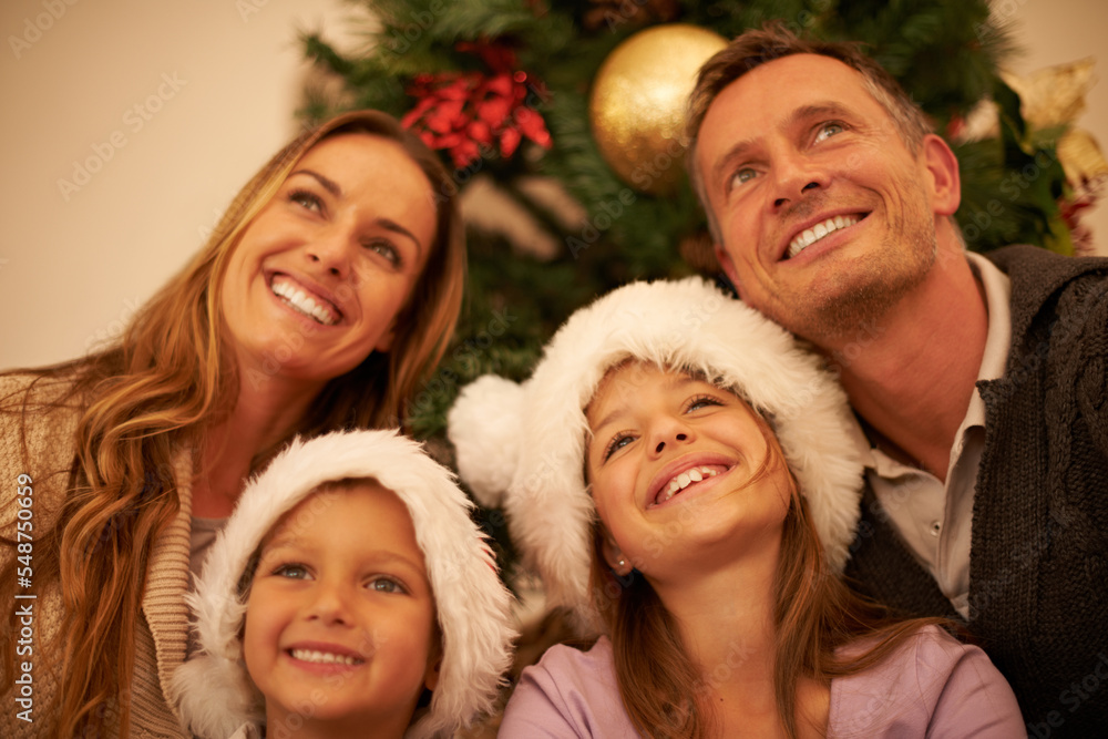 Wall mural happy family love, Christmas celebration and face of mother, father and children bond together on festive holiday. Happiness, wow and relax mom, dad and youth kids looking up during fun global event