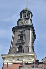 Fototapeta na wymiar Tower of Church with clock germany black blue