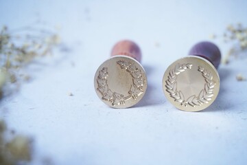 Pretty wax coins made from wax bead and stamp for a vintage look in letter or wedding invitation