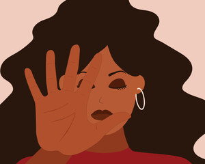 African American woman saying NO and rejects something in front of her. Strong black female expresses disagreement and protest. Concept of Body language and non verbal communication of STOP and ENOUGH