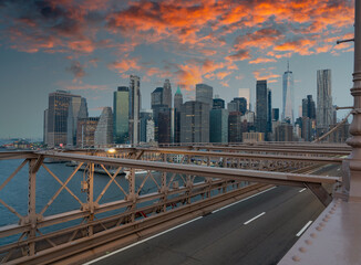 Fototapeta na wymiar Panorama of dramatic sky over New York skyscrapers view from Brooklyn Bridge