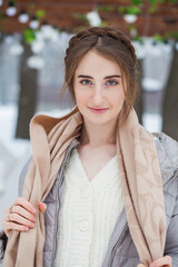 Close up portrait of young woman, winter park outdoors