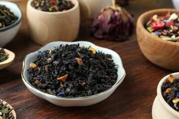 Many different herbal teas on wooden table