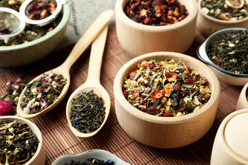 Many different herbal teas on bamboo mat